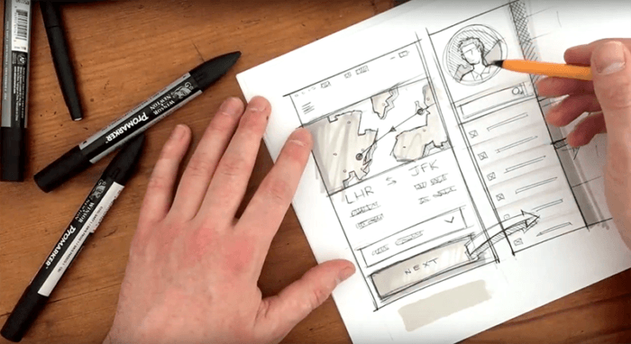  Designer sketching a website layout in a notebook