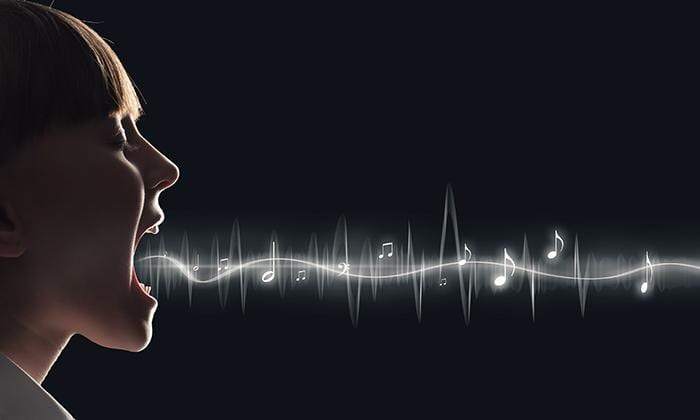  Woman with mouth open and music notes emanate from her mouth.