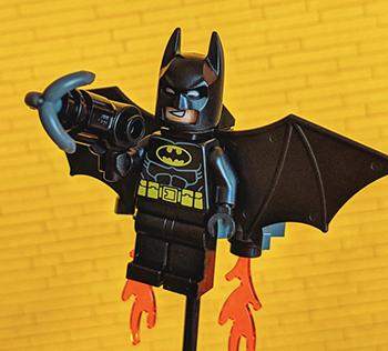 A black batman lego piece is used to to highlight the design inspiration behind developer of the social meetup ui kit and the importance of working within constraints.