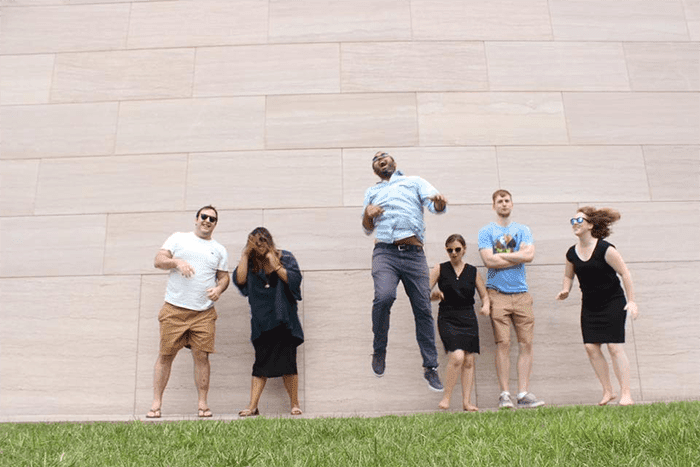 A photograph of Rachel Grossman and her classmates posing outside of the General Assembly campus.