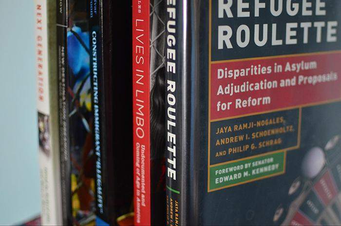 A selection of books and their authors are pictured as some of the secondary sources Alba has been using on the Central American asylum project.