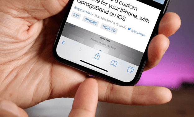 Person pointing at the virtual home indicator on an iPhone