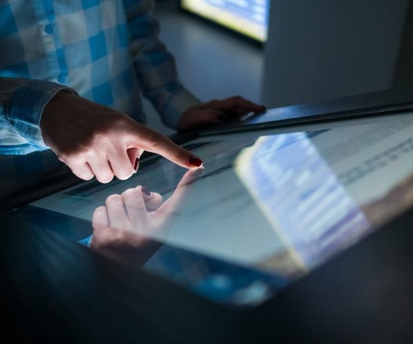 Man using touch screen technology