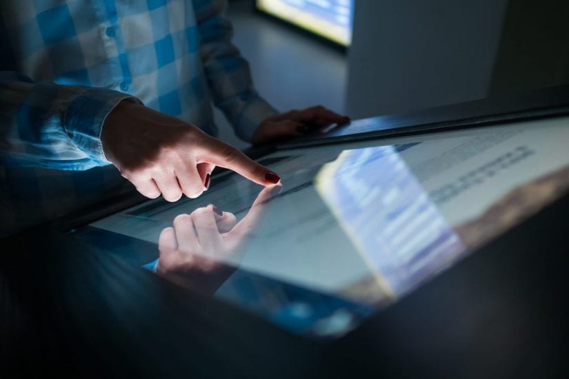 Man using touch screen technology