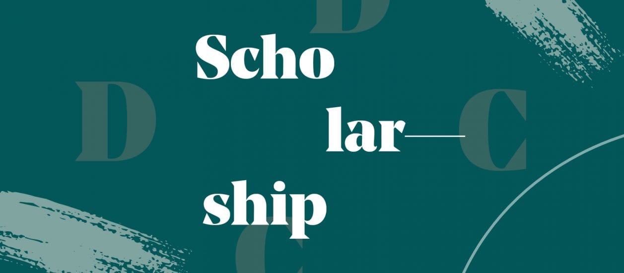 Green banner that has the words Scholarship spelled out on it