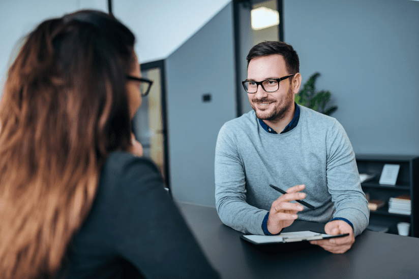 Business man interviewing a female in an office