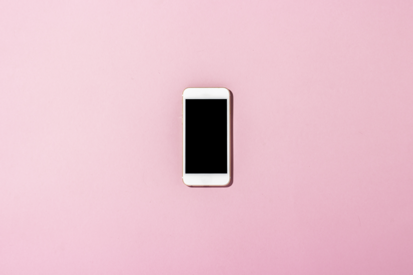 iphone on a pink background