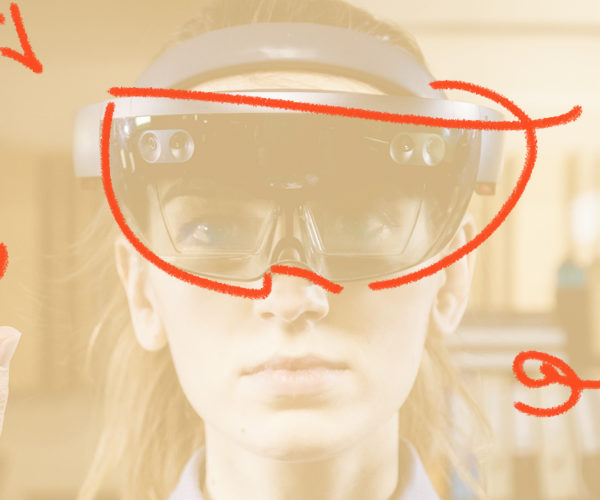Photograph of a woman with an AR mask penciled in over her face.
