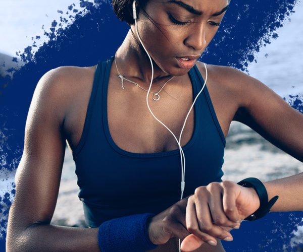 Women checking her smartwatch while exercising