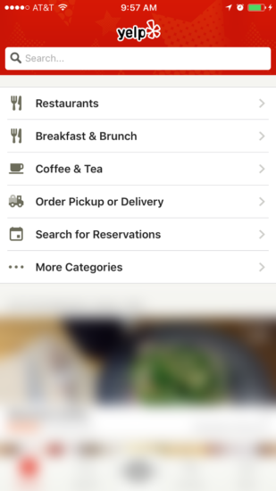 Yelp's mobile application utilizes a full-screen navigation menu for its users. 