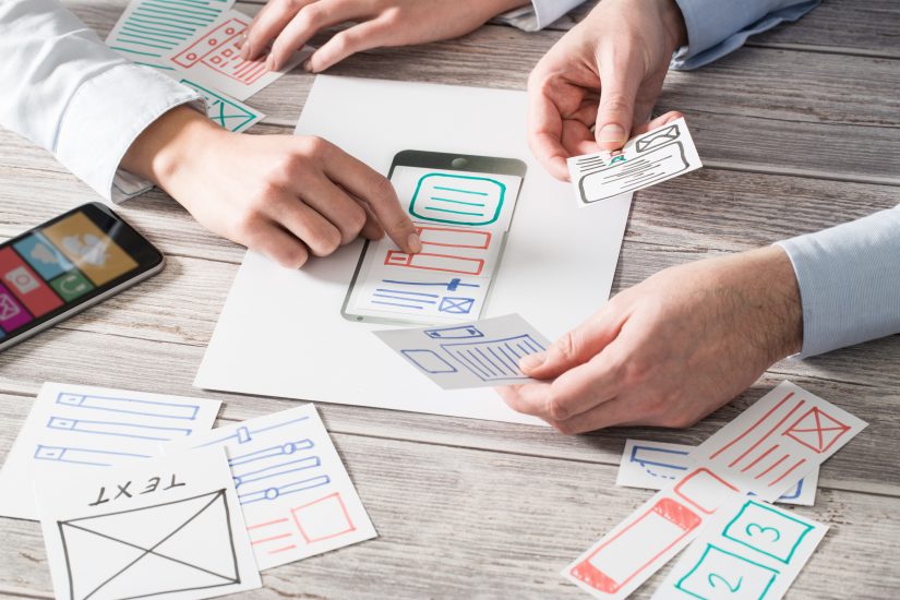 UX engineers draw drafts to showcase the UX of an application.