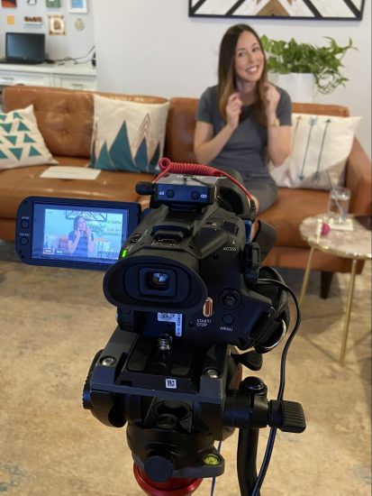 Patti Carlson sits in front of a camera to record a talk for an online conference, as part of the leadership track.